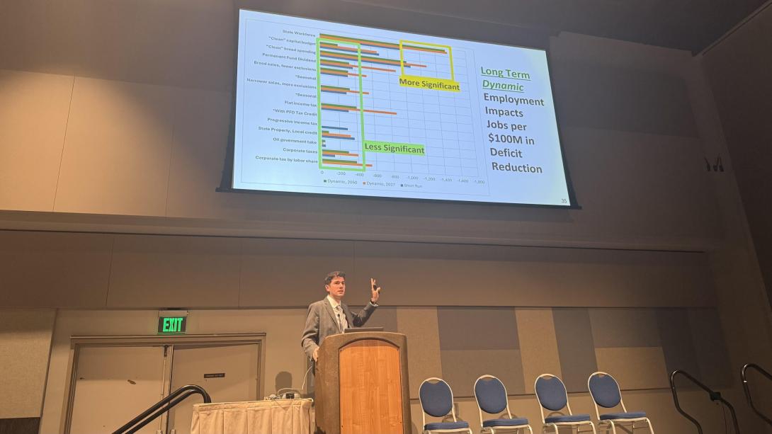 Man presenting powerpoint slide.